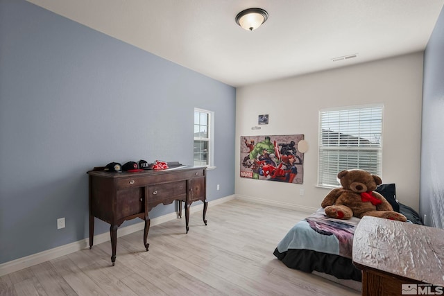 bedroom featuring light wood-type flooring