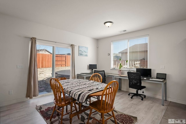 dining area with light hardwood / wood-style flooring