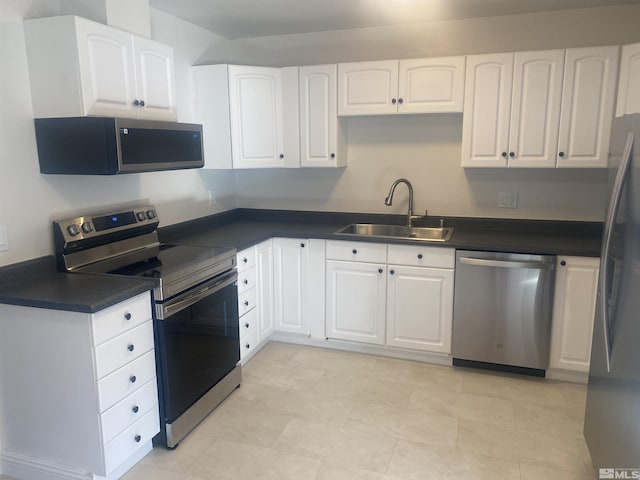 kitchen featuring sink, white cabinets, and stainless steel appliances