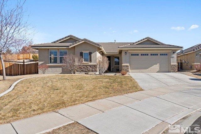 ranch-style house with a garage and a front lawn