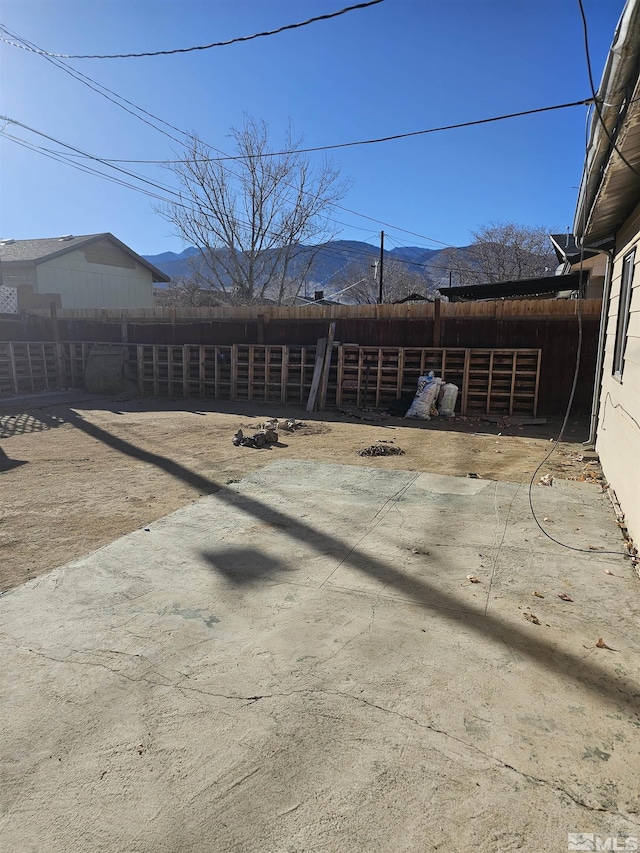 exterior space with a mountain view and a patio