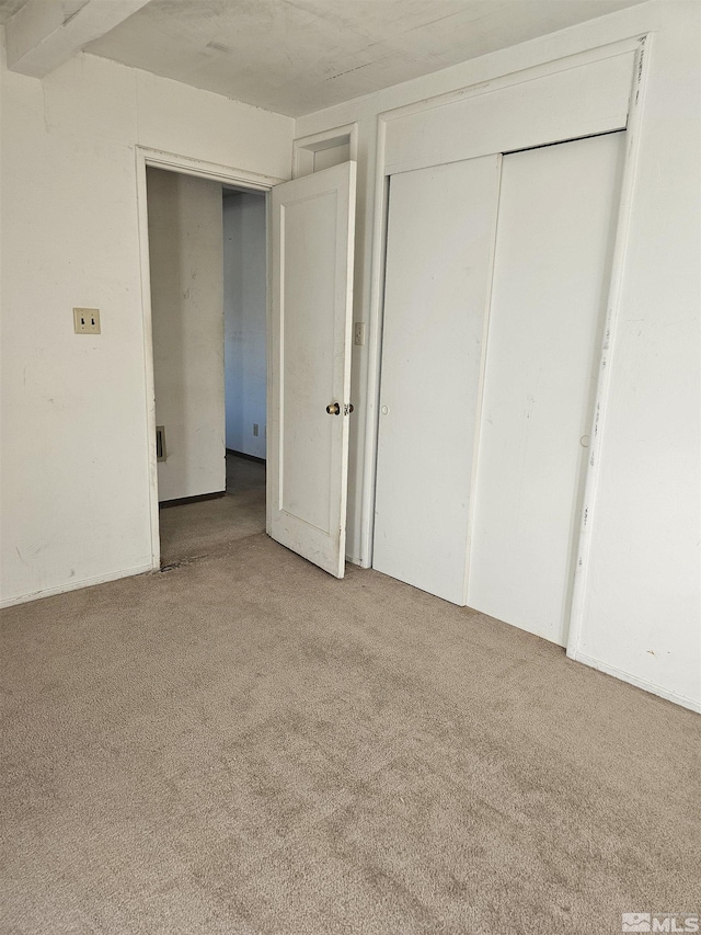 unfurnished bedroom with carpet flooring