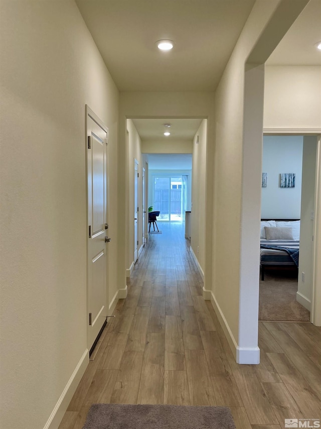 hallway featuring light wood-type flooring