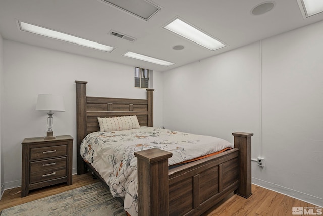 bedroom featuring dark hardwood / wood-style floors
