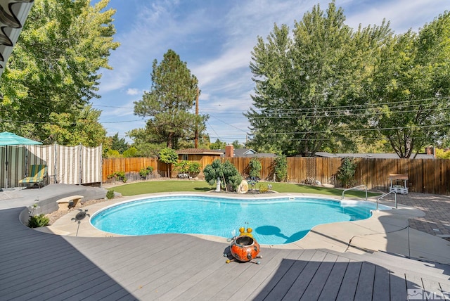 view of pool with a patio area and a deck
