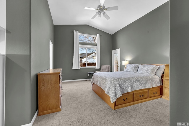 carpeted bedroom featuring ceiling fan and lofted ceiling