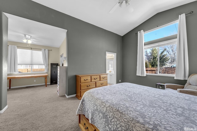 carpeted bedroom with ceiling fan, multiple windows, and lofted ceiling