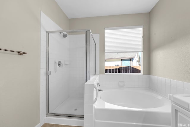 bathroom featuring vanity and separate shower and tub