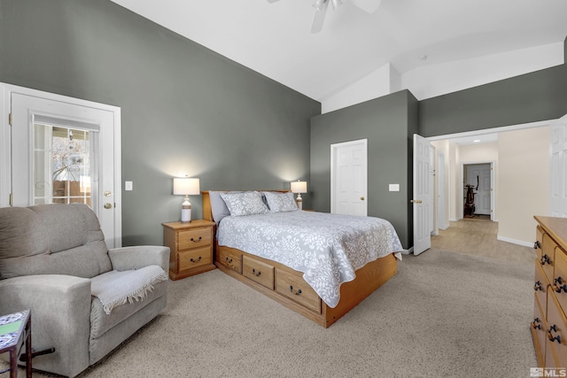 bedroom with ceiling fan, high vaulted ceiling, and light colored carpet