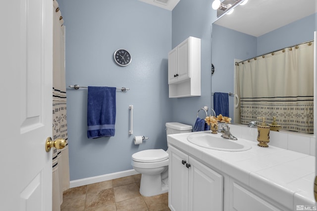 bathroom featuring toilet, tile patterned flooring, and vanity