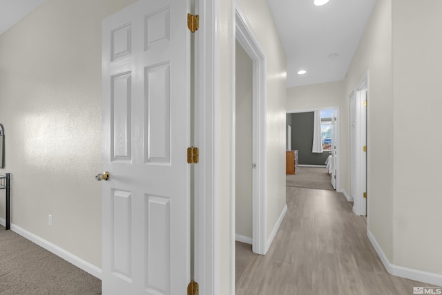 corridor featuring light hardwood / wood-style flooring