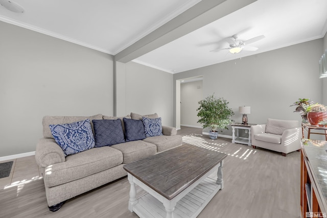 living room with ceiling fan, wood-type flooring, and crown molding