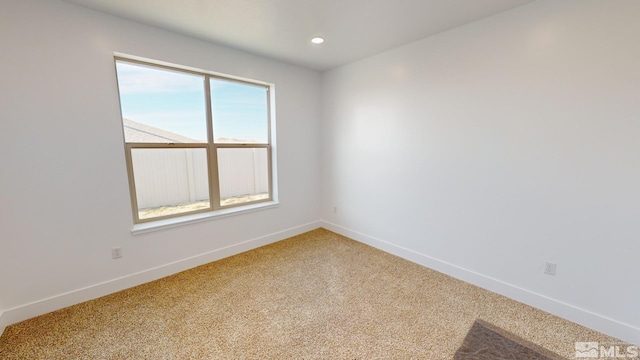 unfurnished room featuring carpet flooring