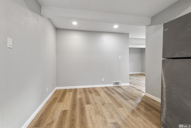 unfurnished room featuring light hardwood / wood-style floors