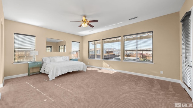 bedroom with ceiling fan and carpet