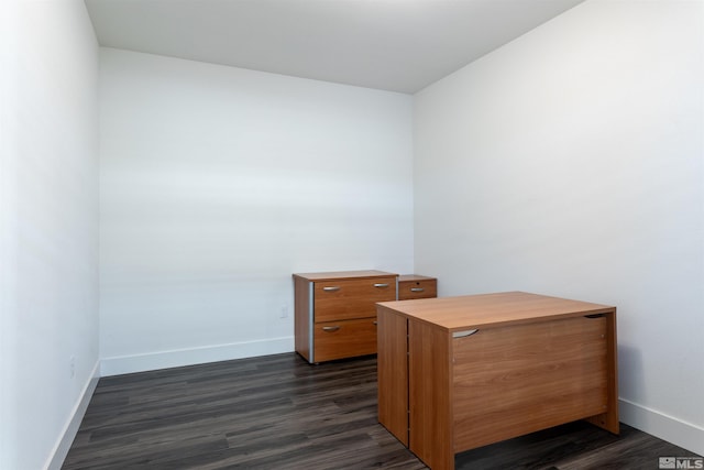 home office with dark wood-type flooring