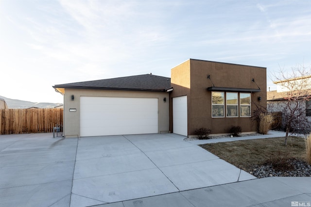 view of front of house featuring a garage and a mountain view