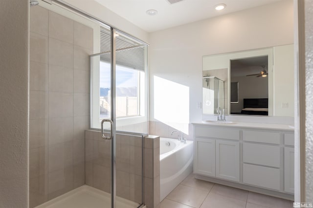 bathroom featuring tile patterned flooring, vanity, separate shower and tub, and ceiling fan