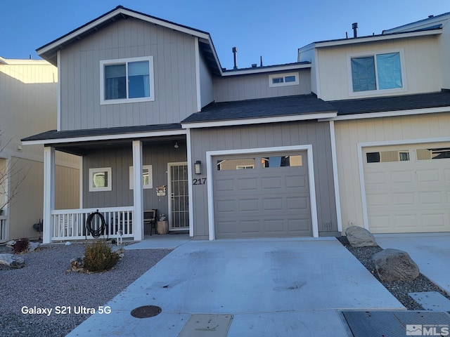 front of property featuring a garage and covered porch