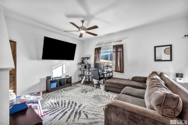 living room featuring hardwood / wood-style flooring and ceiling fan