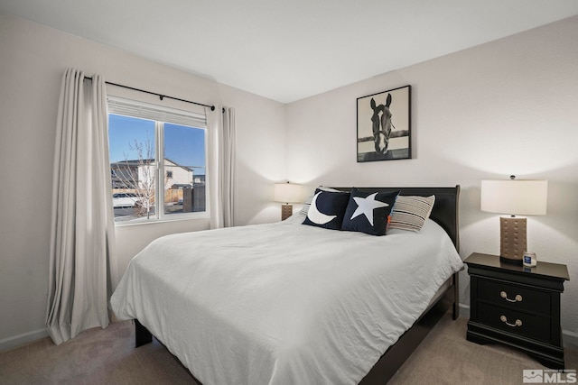 bedroom featuring light colored carpet