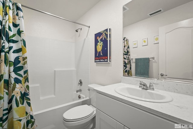 full bathroom with shower / tub combo with curtain, vanity, and toilet