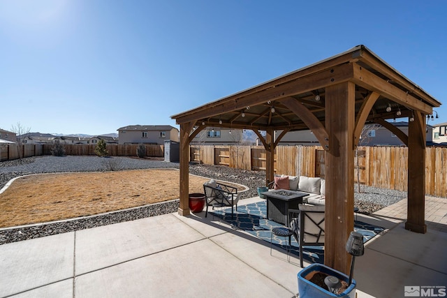 view of patio with a gazebo and an outdoor fire pit