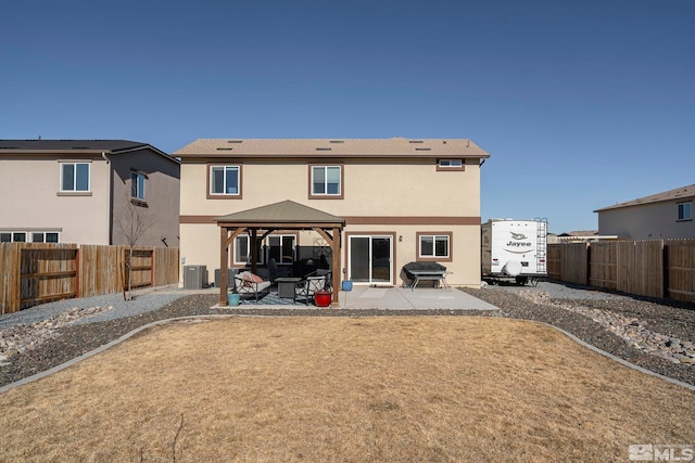 back of house featuring a gazebo, a patio area, and central air condition unit