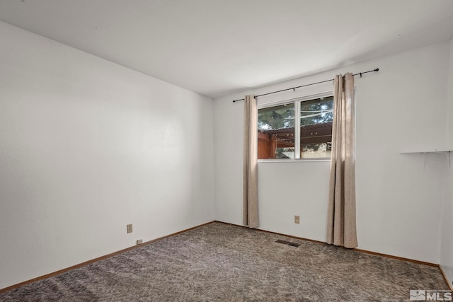 unfurnished room featuring carpet flooring