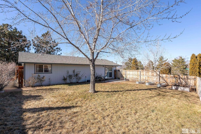 rear view of house with a lawn