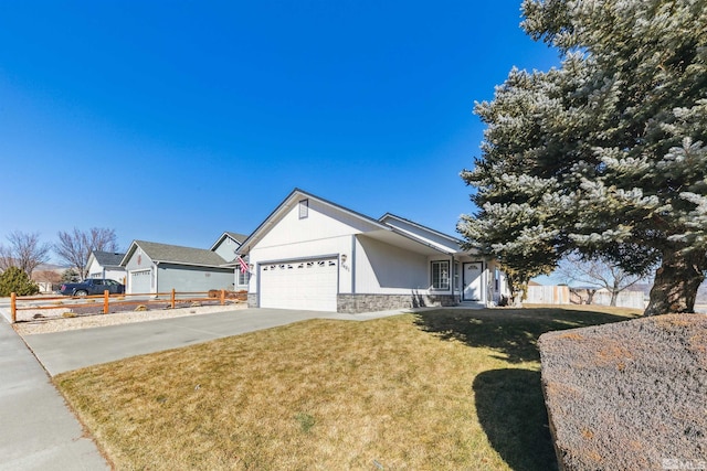 ranch-style home featuring a garage and a front yard