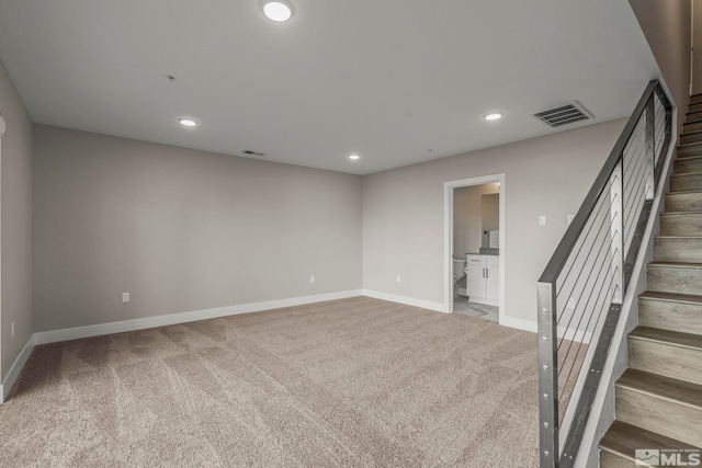 interior space featuring light colored carpet