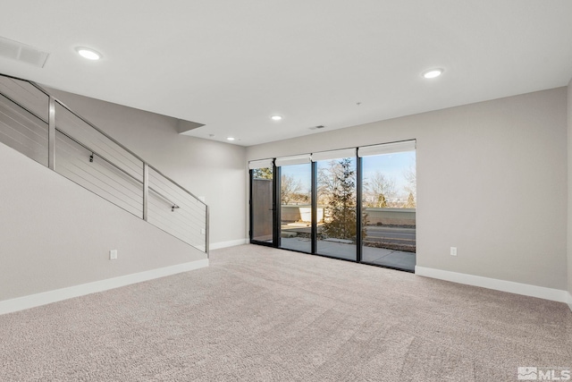 unfurnished living room with light carpet