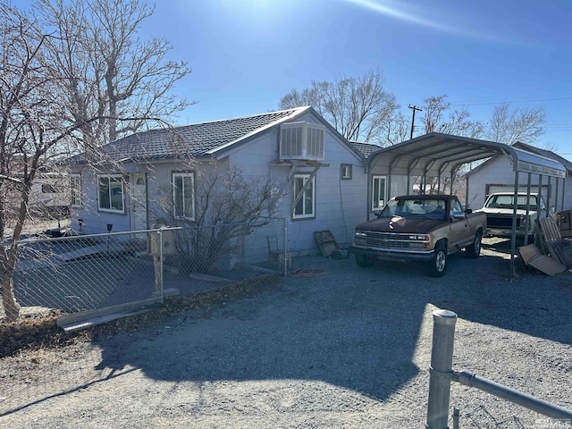 view of front of home featuring a carport