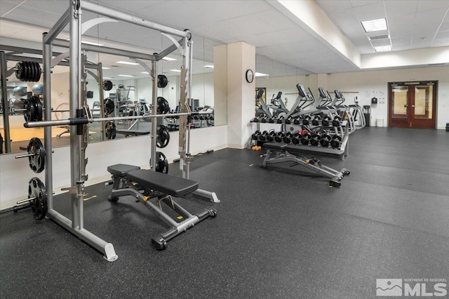 workout area with a paneled ceiling