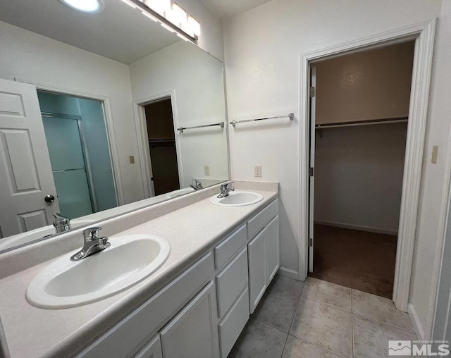 bathroom featuring vanity and tile patterned flooring