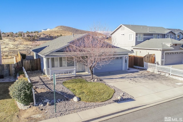 view of front of house with a mountain view and a garage