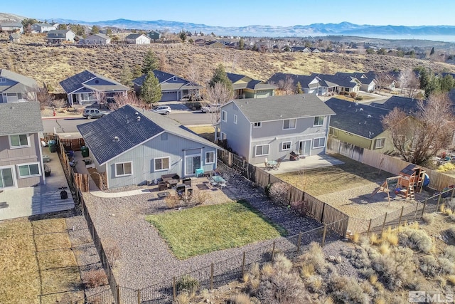 birds eye view of property with a mountain view