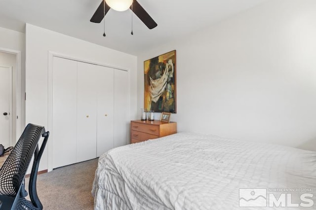 carpeted bedroom featuring a closet and ceiling fan