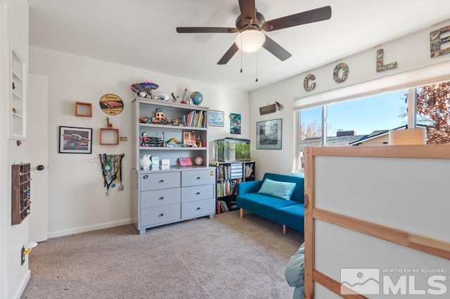 bedroom featuring light carpet and ceiling fan