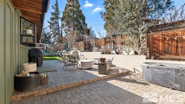 view of patio featuring a grill and a trampoline