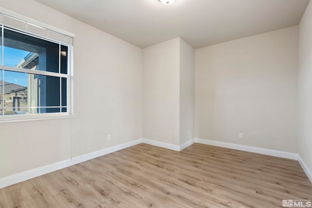 spare room with light wood-type flooring