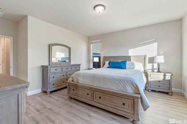 bedroom with light wood-type flooring