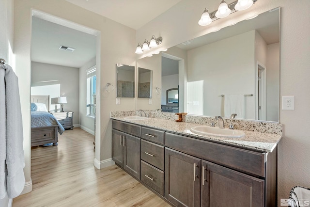 bathroom with vanity and hardwood / wood-style floors