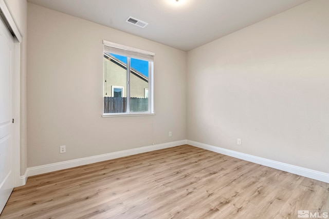 unfurnished room featuring light wood-type flooring