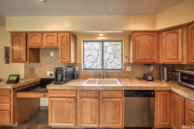 kitchen featuring sink, stainless steel dishwasher, and decorative backsplash