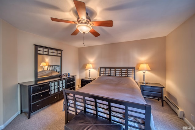 carpeted bedroom with a baseboard radiator and ceiling fan