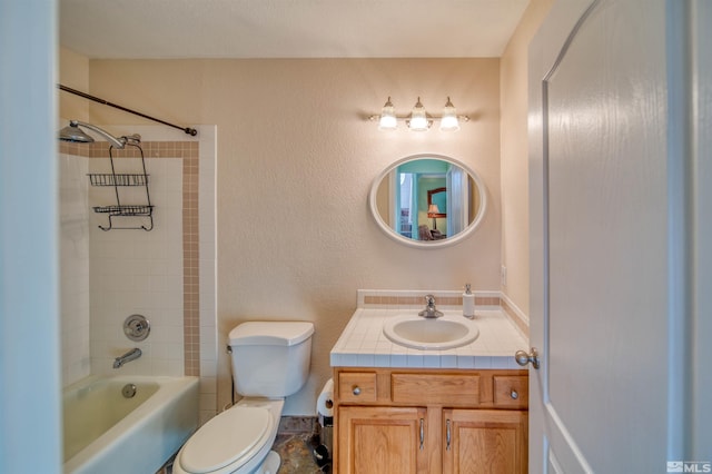 full bathroom with tiled shower / bath combo, vanity, and toilet