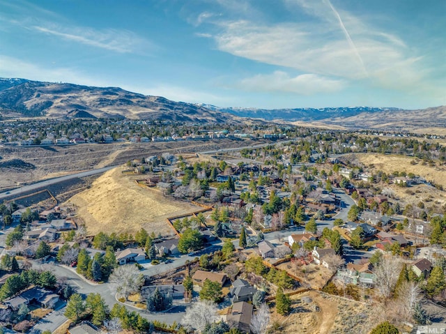 birds eye view of property with a mountain view