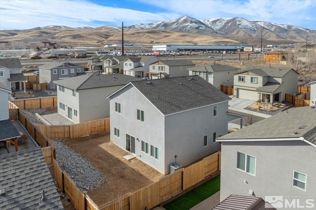 birds eye view of property with a mountain view